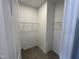 Spacious walk-in closet features neutral paint, carpet and metal shelving at 1945 Plott Balsam Dr, Wendell, NC 27591