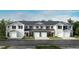 New townhomes feature white and gray facades, single-car garages, and professionally landscaped lawns at 2003 Rabbitbrush St, Durham, NC 27704