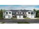 Charming townhome featuring a landscaped front yard and convenient garage entry at 2009 Rabbitbrush St, Durham, NC 27704