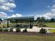 Neighborhood playground and picnic area with tables, playground equipment and green grass perfect for outdoor gatherings at 201 Jetson Creek Way, Youngsville, NC 27596