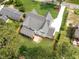 This aerial view shows the home's spacious yard, patio, and proximity to mature trees and landscaping at 217 Dublin Rd, Raleigh, NC 27609