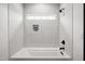 Modern bathroom features a white tiled shower and a niche with decorative bottles at 217 Dublin Rd, Raleigh, NC 27609