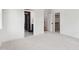 Bright bedroom with doorways to an ensuite bathroom and walk-in closet at 217 Dublin Rd, Raleigh, NC 27609