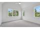 Bright bedroom with large windows offering natural light and neutral carpet at 217 Dublin Rd, Raleigh, NC 27609