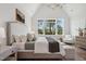 Bright bedroom featuring a vaulted ceiling, modern chandelier, and natural light at 217 Dublin Rd, Raleigh, NC 27609
