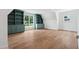Spacious bonus room features wood floors, built-in shelving, and plenty of natural light from the window at 217 Dublin Rd, Raleigh, NC 27609