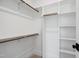 Walk-in closet with built-in shelving and closet rods for ample storage at 217 Dublin Rd, Raleigh, NC 27609
