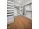 Walk-in closet featuring custom shelving and ample storage space for an organized wardrobe at 217 Dublin Rd, Raleigh, NC 27609