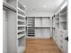 Spacious walk-in closet with custom storage solutions, rods, and shelving for optimal organization at 217 Dublin Rd, Raleigh, NC 27609