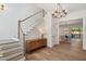 Elegant entryway with hardwood floors, staircase, and modern chandelier at 217 Dublin Rd, Raleigh, NC 27609