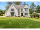 Charming exterior view of two-story home with lush green lawn and landscaping at 217 Dublin Rd, Raleigh, NC 27609