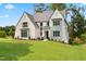 Attractive exterior view of a white home with well-maintained landscaping at 217 Dublin Rd, Raleigh, NC 27609