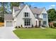 Exterior of home featuring lush green lawn, landscaping, and a driveway at 217 Dublin Rd, Raleigh, NC 27609