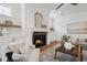 Beautiful fireplace with decor, flanking cabinets, and accent mirror in living room at 217 Dublin Rd, Raleigh, NC 27609