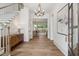 Bright foyer with hardwood floors, staircase, and stylish chandelier at 217 Dublin Rd, Raleigh, NC 27609