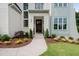 Inviting front entrance with a dark wood door and manicured landscaping at 217 Dublin Rd, Raleigh, NC 27609