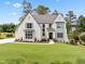 Charming two-story home with manicured lawn, beautiful landscaping, and inviting curb appeal at 217 Dublin Rd, Raleigh, NC 27609