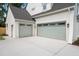 Spacious two car garage with matching doors, lighting and driveway at 217 Dublin Rd, Raleigh, NC 27609