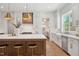 Bright, updated kitchen with island seating, stainless steel appliances, and designer finishes at 217 Dublin Rd, Raleigh, NC 27609