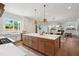 Open kitchen featuring a large island, modern appliances, and bright lighting at 217 Dublin Rd, Raleigh, NC 27609