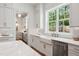 Clean white kitchen with stainless steel appliances and plenty of natural light from the window at 217 Dublin Rd, Raleigh, NC 27609