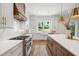 Well-appointed kitchen with marble countertops, gas range, an island, and a bright window at 217 Dublin Rd, Raleigh, NC 27609
