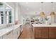 An open concept kitchen extends into dining and Gathering spaces at 217 Dublin Rd, Raleigh, NC 27609