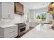Gourmet kitchen features stainless steel appliances, custom cabinetry, and elegant countertops at 217 Dublin Rd, Raleigh, NC 27609