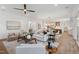 Bright living room with hardwood floors, fireplace, and open layout to kitchen and dining area at 217 Dublin Rd, Raleigh, NC 27609