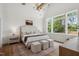 Bright bedroom featuring large windows, vaulted ceiling, a decorative rug, and modern decor at 217 Dublin Rd, Raleigh, NC 27609