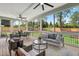 Spacious screened porch with comfortable seating, ceiling fans, and a serene view of the backyard at 217 Dublin Rd, Raleigh, NC 27609