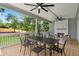 Covered porch with a dining table, fireplace, and comfortable seating for outdoor entertaining at 217 Dublin Rd, Raleigh, NC 27609
