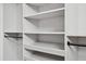 Close up of walk-in closet shelving and hanging rods at 217 Dublin Rd, Raleigh, NC 27609