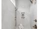Modern tiled shower with a rainfall showerhead, handheld sprayer, and convenient built-in shelving at 217 Dublin Rd, Raleigh, NC 27609