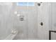 Bright, spacious shower stall featuring white tile, built-in seat and niche for bath products at 217 Dublin Rd, Raleigh, NC 27609