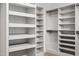Bright walk-in closet featuring custom shelving and hanging space for optimal organization at 217 Dublin Rd, Raleigh, NC 27609