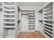 Large walk-in closet with built-in shelving and hanging rods, providing a luxurious storage solution at 217 Dublin Rd, Raleigh, NC 27609