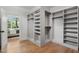 Spacious walk-in closet with custom shelving and hanging rods, offering ample storage at 217 Dublin Rd, Raleigh, NC 27609
