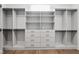Bright walk-in closet featuring custom shelving, drawers, and hanging space for optimal organization at 217 Dublin Rd, Raleigh, NC 27609
