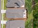 Aerial view of homes with backyard patios, manicured lawns, and neat landscaping at 248 Speight Branch Rd, Cary, NC 27518