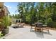 Cozy backyard patio with outdoor furniture, landscaping, and privacy fence at 248 Speight Branch Rd, Cary, NC 27518