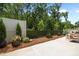 Landscaped backyard with privacy fence and outdoor seating at 248 Speight Branch Rd, Cary, NC 27518