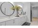 A spacious bathroom includes double sinks, modern mirrors, and stylish decor accents at 248 Speight Branch Rd, Cary, NC 27518