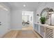 Inviting foyer with wood-look floors and view to a home office space at 248 Speight Branch Rd, Cary, NC 27518