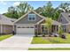 Charming single-Gathering home featuring stone accents, a two-car garage, and beautifully landscaped front yard at 248 Speight Branch Rd, Cary, NC 27518