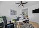 Bright office featuring a modern round table, stylish chairs, and a black ceiling fan at 248 Speight Branch Rd, Cary, NC 27518