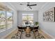 Cozy home office filled with natural light, modern decor, a ceiling fan, and a round table at 248 Speight Branch Rd, Cary, NC 27518