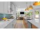 Bright, modern kitchen featuring stainless appliances, a kitchen island, and an open view to the living room at 248 Speight Branch Rd, Cary, NC 27518