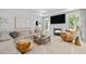 Comfortable living room with a fireplace, large windows, and stylish decor at 248 Speight Branch Rd, Cary, NC 27518