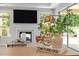 Open living room with fireplace, and modern decor at 248 Speight Branch Rd, Cary, NC 27518